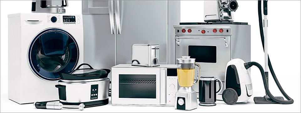 Photograph of a large group of consumer electronics including a washing machine, coffee maker, toaster, crock pot, microwave, blender, vacuum, stove and refrigerator, among many others.
